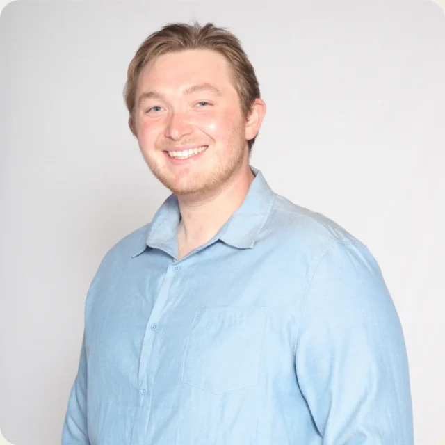 Jonathan Younger, Student Pastor at Journey Church, smiling in a light blue shirt.
