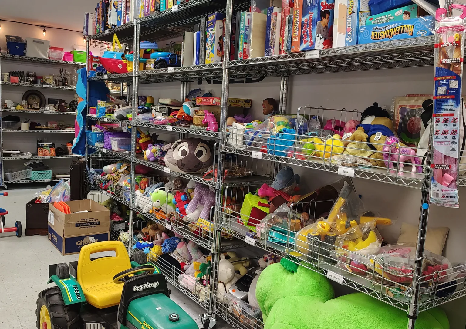 Shelves stocked with donated toys, games and stuffed animals at Journey Provisions