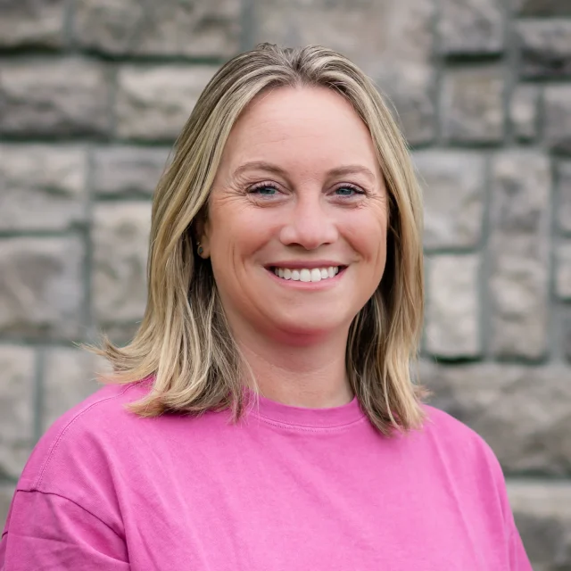 Julia Hayman, Preschool Teacher at Journey Preschool, smiling in a pink top.