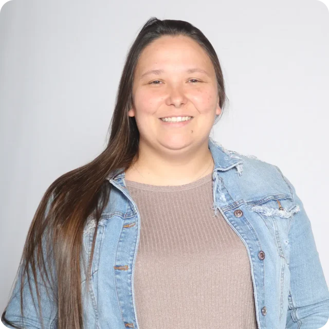 Patricia Callahan, Journey Provisions Manager at Journey Church, smiling in a denim jacket over a tan top.